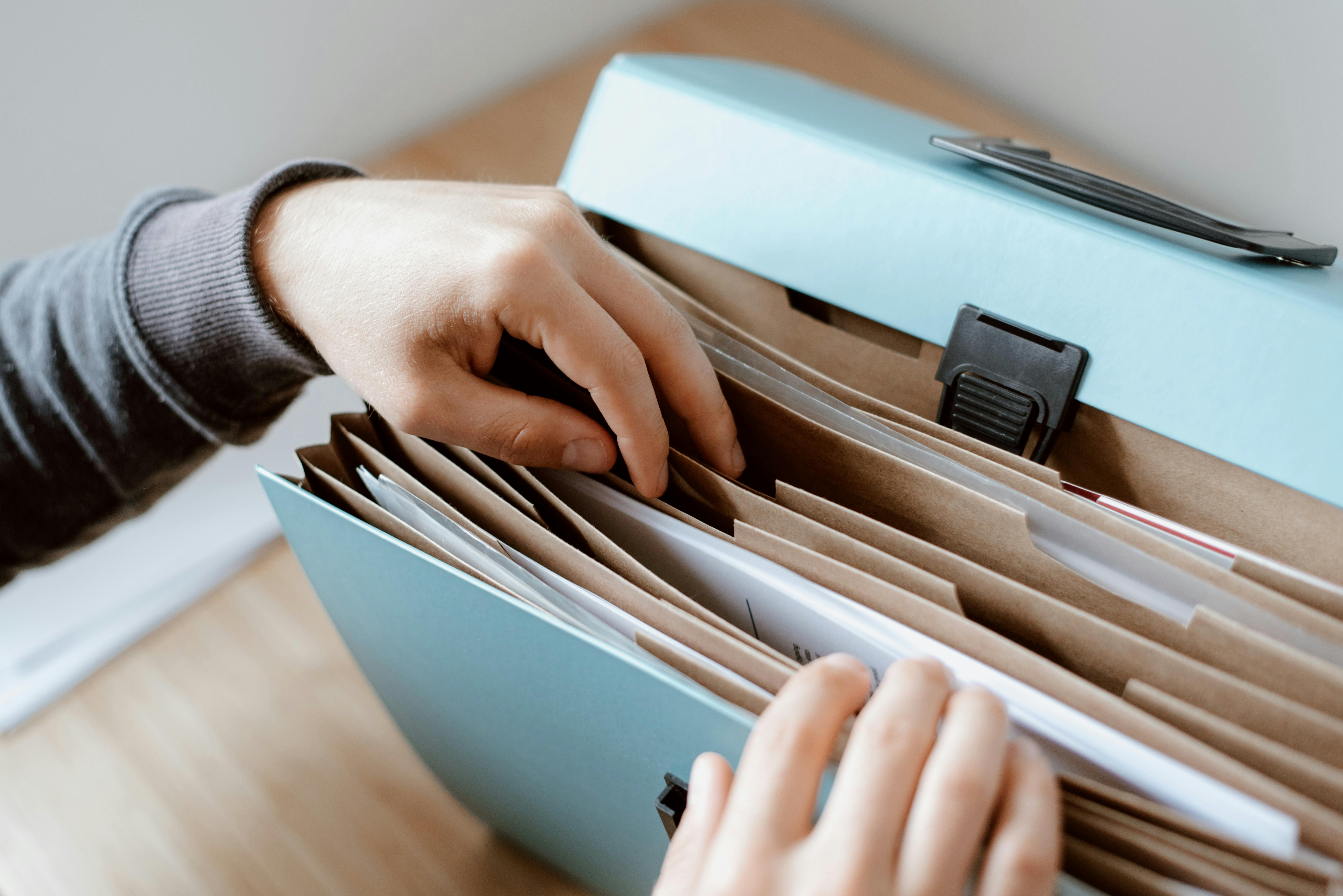 Photo of a trapper keeper with some files in it.